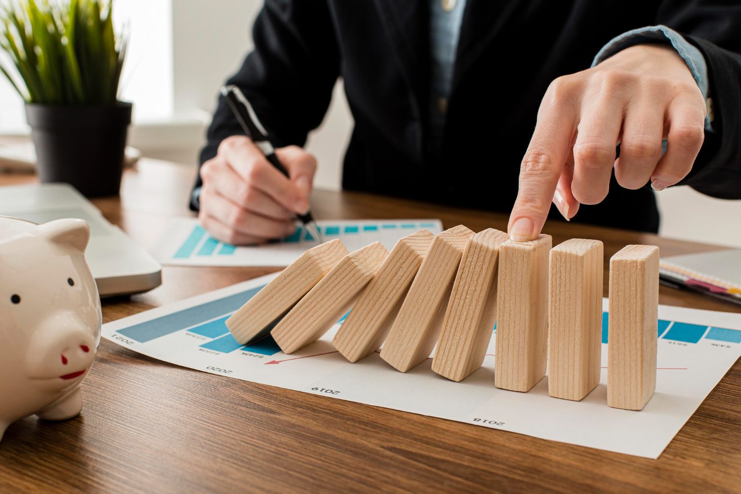 businessman at the office with wooden blocks businessman at the office with wooden blocks