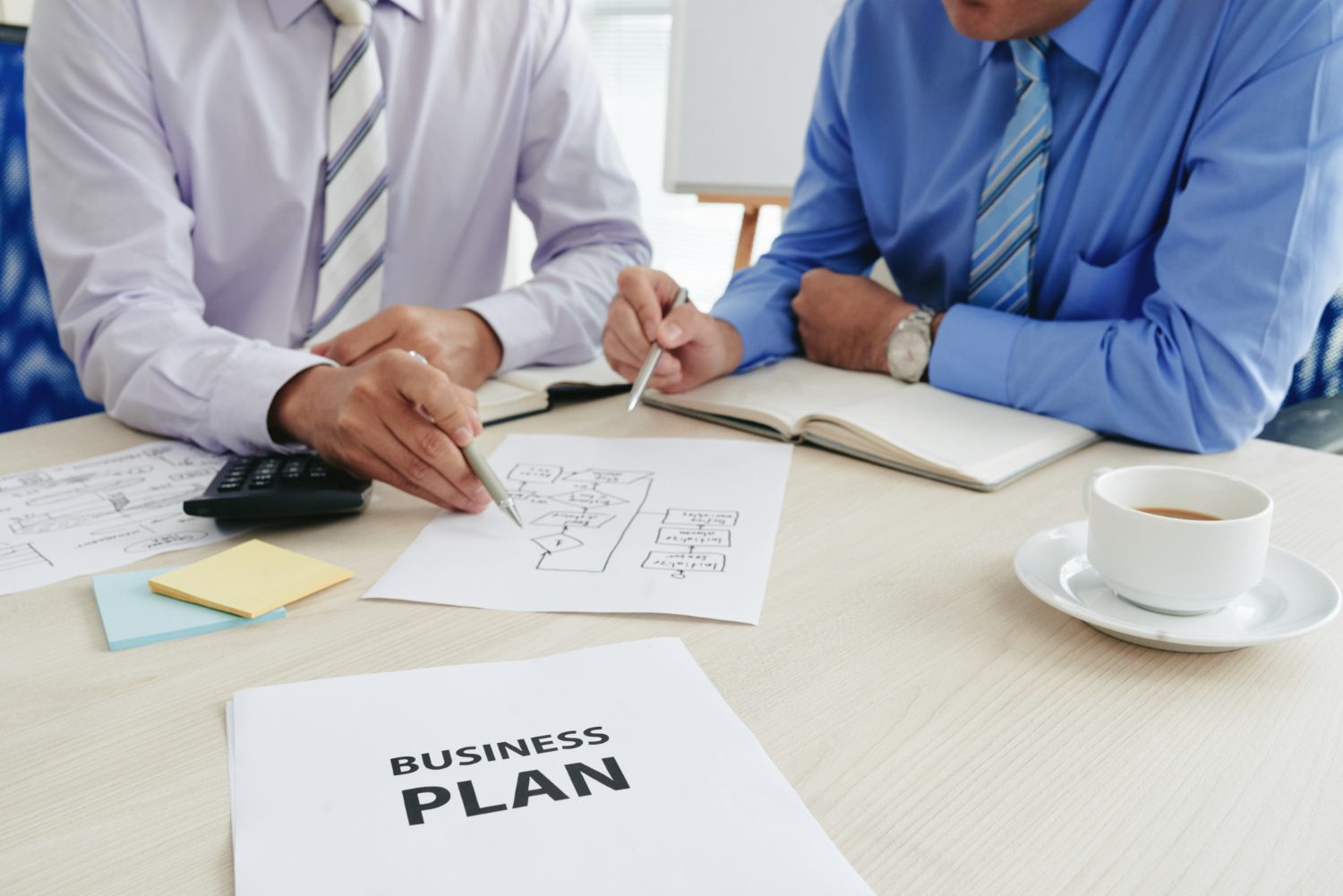 two-cropped-startuppers-developing-business-plan two-cropped-startuppers-developing-business-plan